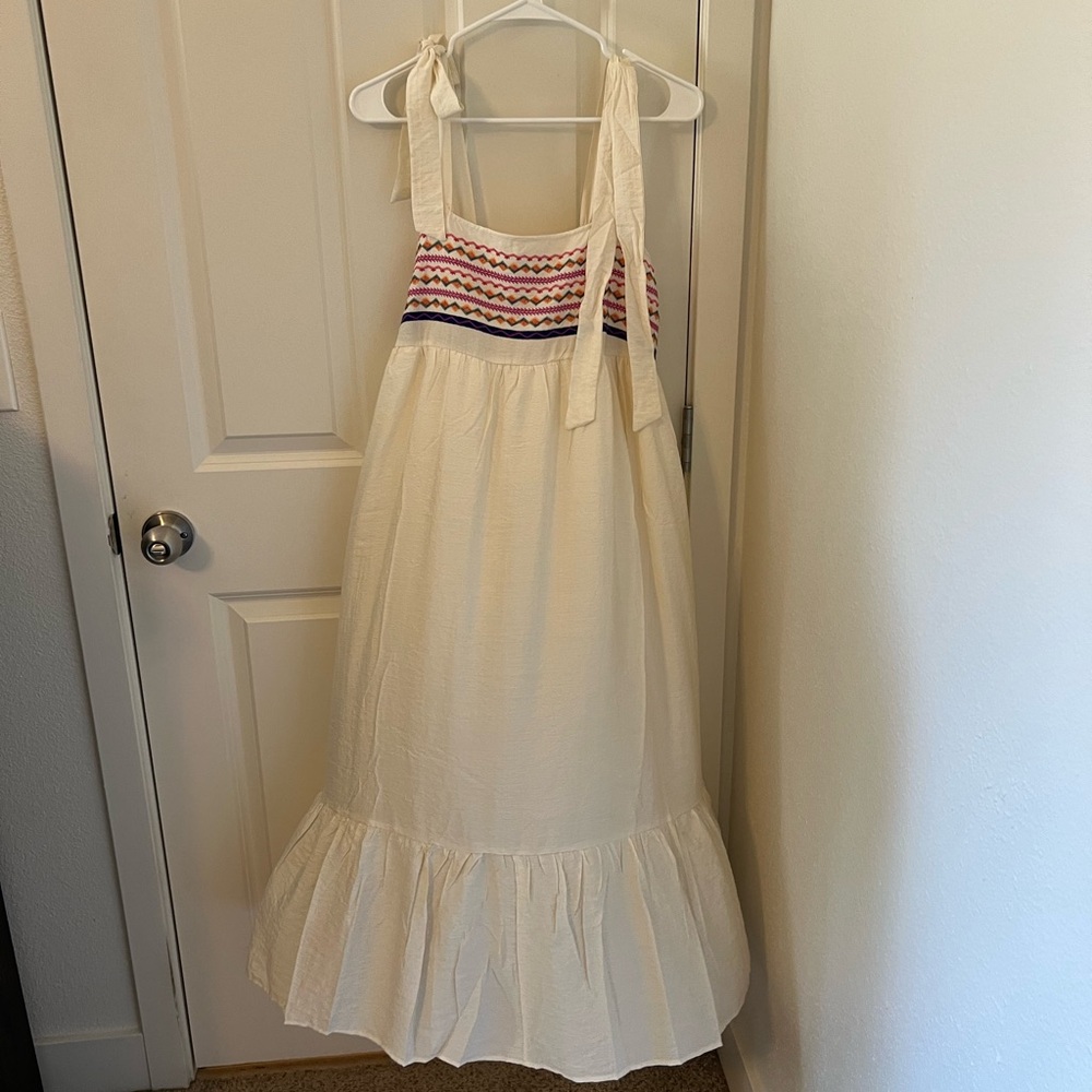 off-white dress with multicolored embroidery